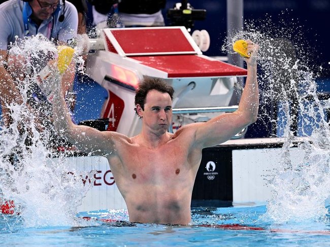 Cam McEvoy celebrates his Olympic gold medal which lifted a proverbial chip off his shoulders.
