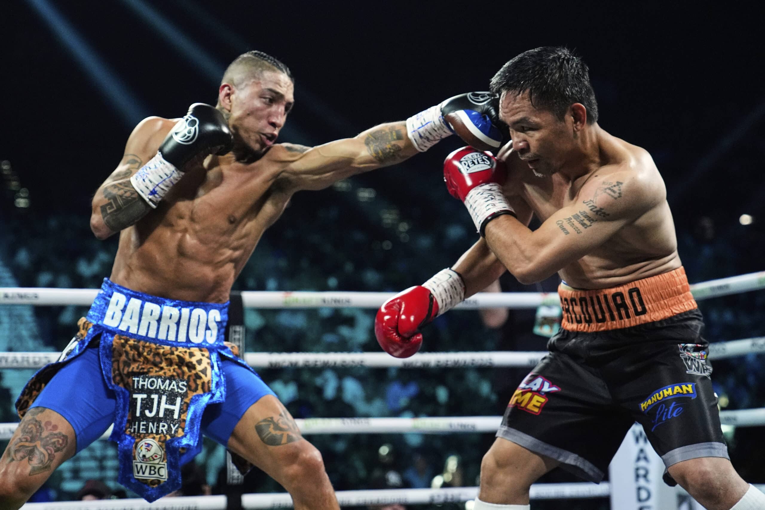 Mario Barrios, left, fights Manny Pacquiao in a welterweight title boxing match Saturday, July 19, 2025, in Las Vegas.