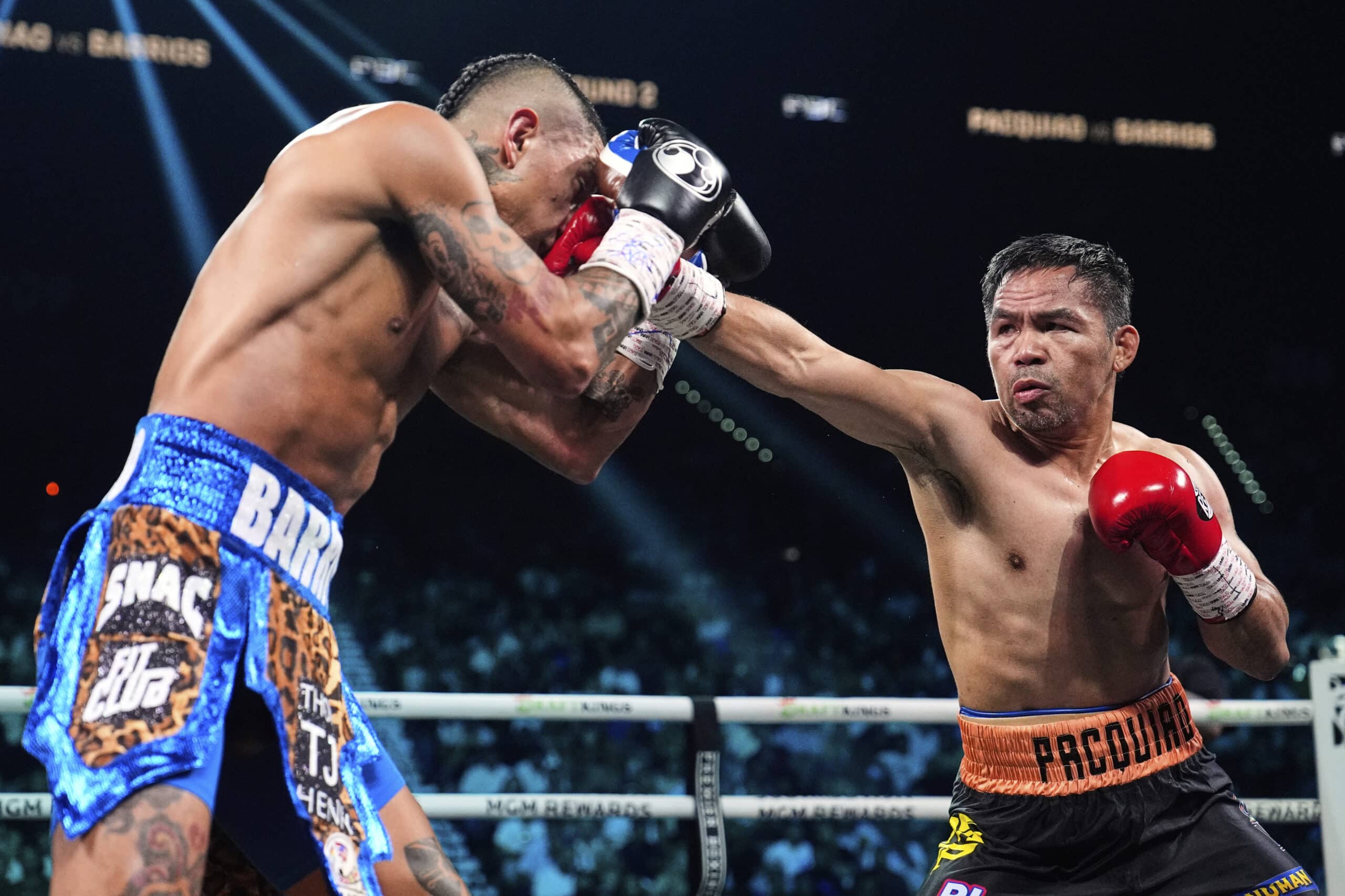 Mario Barrios, left, fights Manny Pacquiao in a welterweight title boxing match Saturday, July 19, 2025, in Las Vegas.