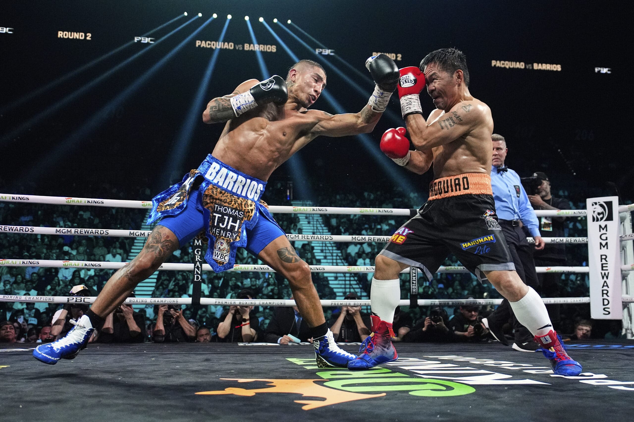 Mario Barrios, left, fights Manny Pacquiao in a welterweight title boxing match Saturday, July 19, 2025, in Las Vegas.