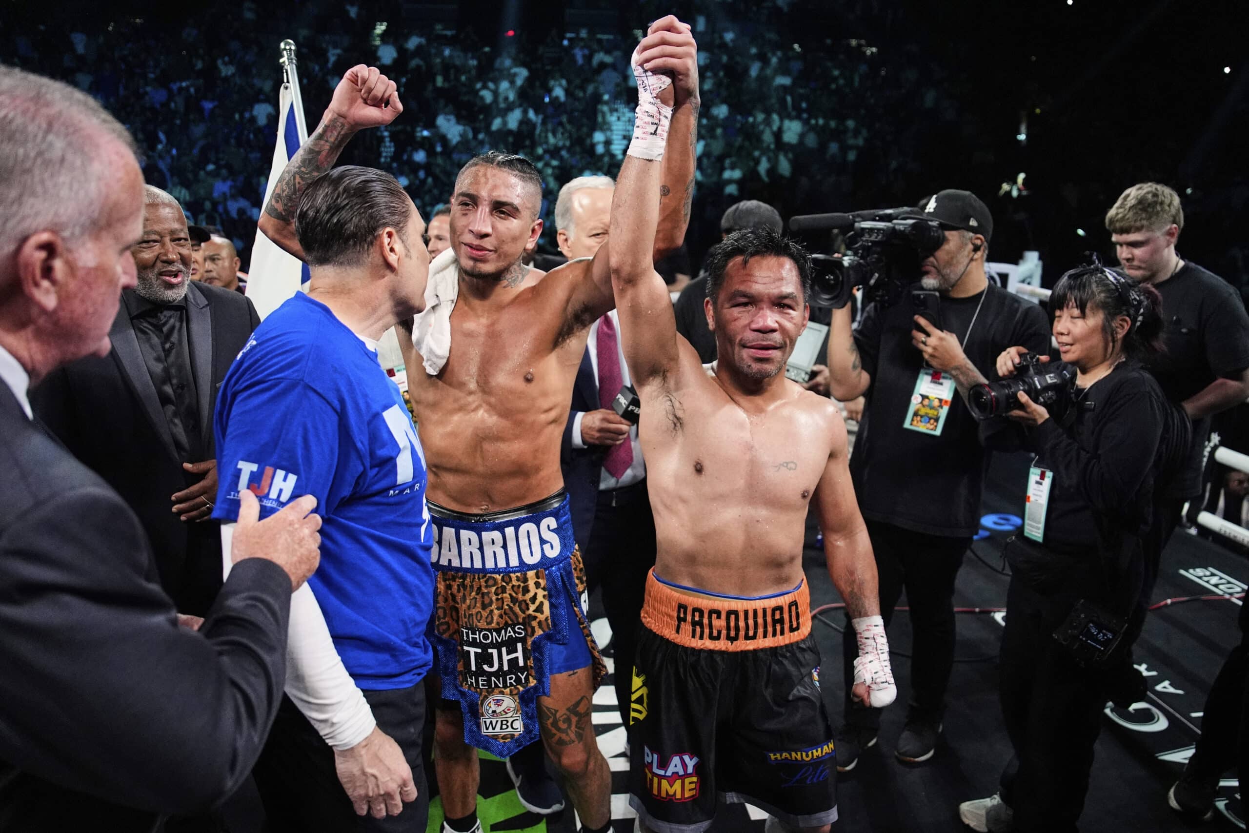 Mario Barrios, left, and Manny Pacquiao reacts after fighting to a majority draw in a welterweight title boxing match Saturday, July 19, 2025, in Las Vegas