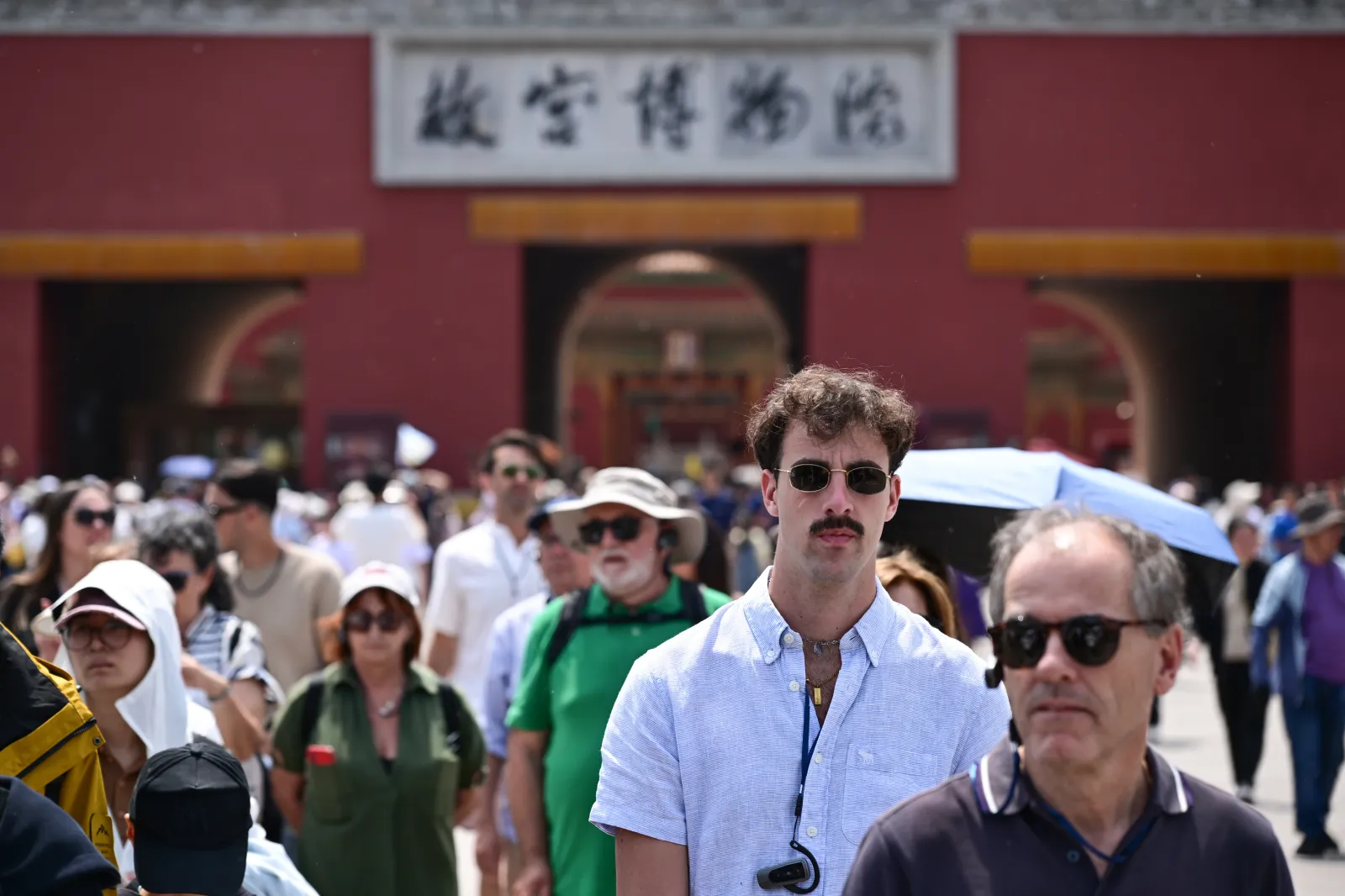 Foreign tourists visit the Palace Museum on the first day of the May Day holiday on May 1 in Beijing.