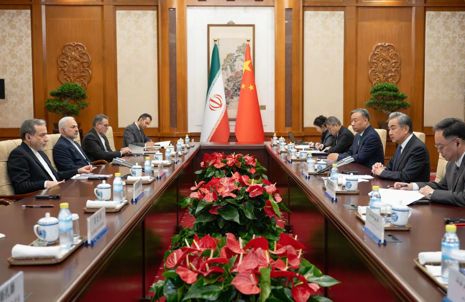 Chinese Foreign Minister Wang Yi, second right, talks to his Iranian counterpart Abbas Araghchi, left, during a bilateral meeting in Beijing on May 6.