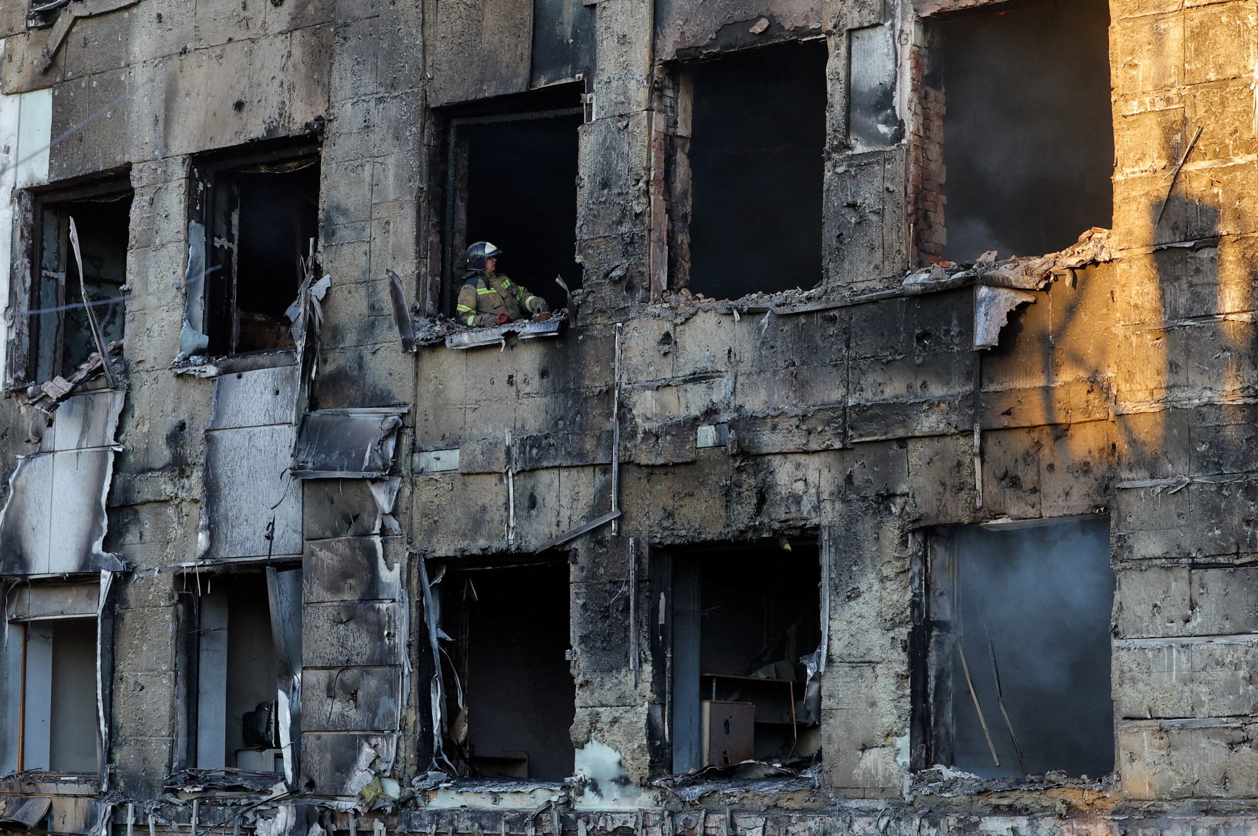 A firefighter works inside a building of a children's hospital, damaged by recent shelling that local Russian-installed authorities called a Ukrainian military strike, while the hospital was under maintenance with no patients inside, in the course of the Russia-Ukraine military conflict in Donetsk, a Russian-controlled city of Ukraine