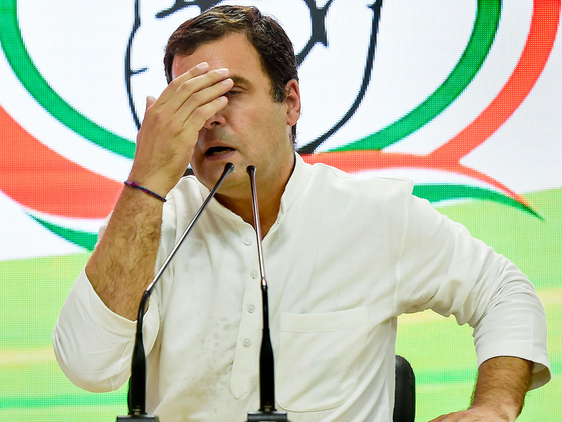 Congress President Rahul Gandhi reacts