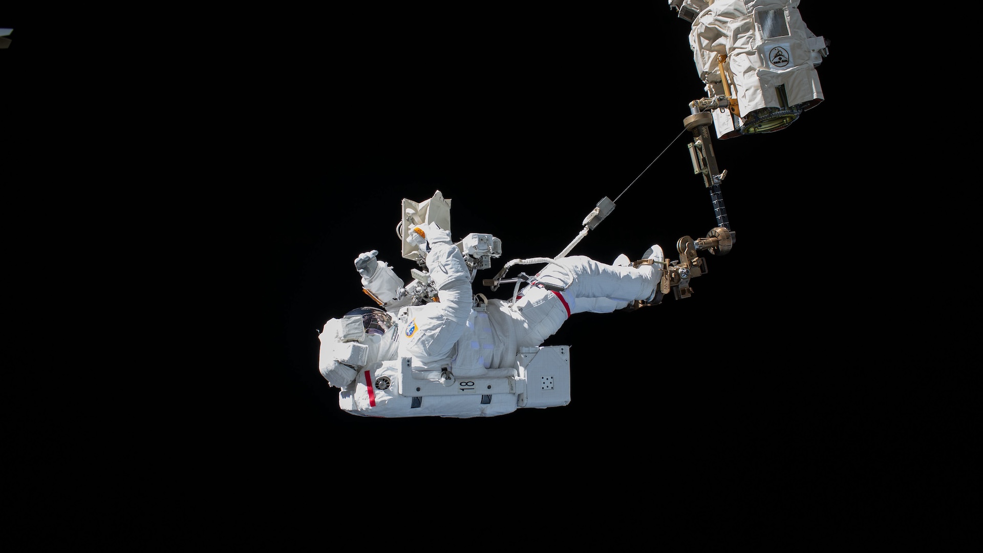 a photograph of an astronaut during a spacewalk