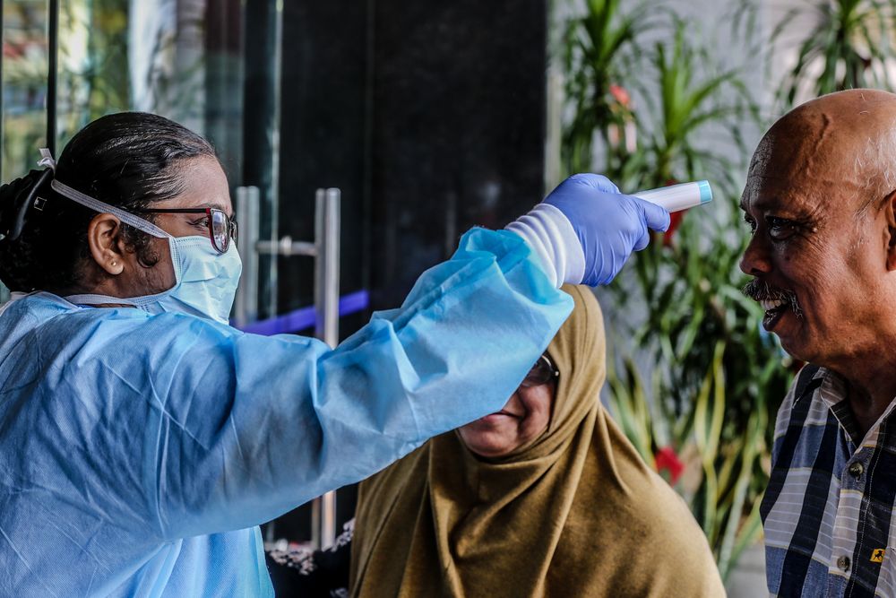 Medical personnel check the temperature of a visitor at the entrance of KPJ Tawakkal hospital in Kuala Lumpur, January 28, 2020. — Picture by Firdaus Latif Medical personnel check the temperature of a visitor at the entrance of KPJ Tawakkal hospital in Kuala Lumpur, January 28, 2020. — Picture by Firdaus Latif