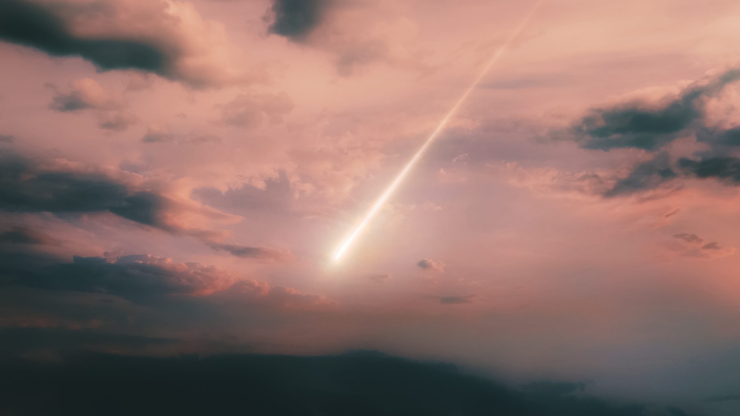 An artist's illustration of a fireball entering the Earth's atmosphere at sunset.