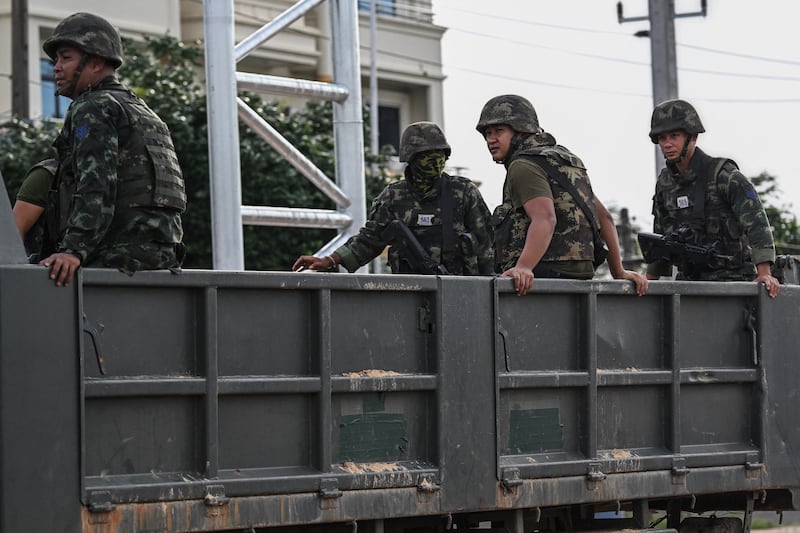 Royal Thai Army soldiers are transported on the back of an army truck in the Thai border province of Si Sa Ket. Photograph: Getty Images