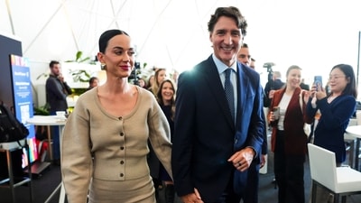 Former Prime Minister Justin Trudeau holds hands with Katy Perry as they leave an event during the World Economic Forum in Davos, Switzerland on Tuesday. (Sean Kilpatrick/The Canadian Press via AP) (AP)