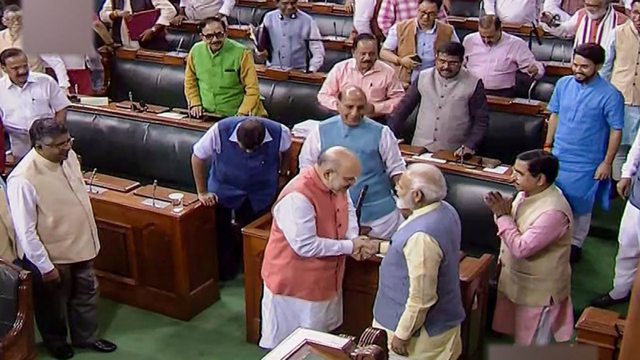 #article370: In one of the first major steps taken by the government after storming to power for a second term, provisions of Article 370 of the Indian Constitution, granting special status to the state of Jammu and Kashmir was scrapped. The historic event made its presence felt on Twitter as well, with debates raging on the fate of J&K after the move even as the internet was snapped there. In this picture, Home Minister Amit Shah is seen with PM Modi after the Bill to bifurcate J&K was passed in Lok Sabha. (Image: PTI) #article370: In one of the first major steps taken by the government after storming to power for a second term, provisions of Article 370 of the Indian Constitution, granting special status to the state of Jammu and Kashmir was scrapped. The historic event made its presence felt on Twitter as well, with debates raging on the fate of J&K after the move even as the internet was snapped there. In this picture, Home Minister Amit Shah is seen with PM Modi after the Bill to bifurcate J&K was passed in Lok Sabha. (Image: PTI)