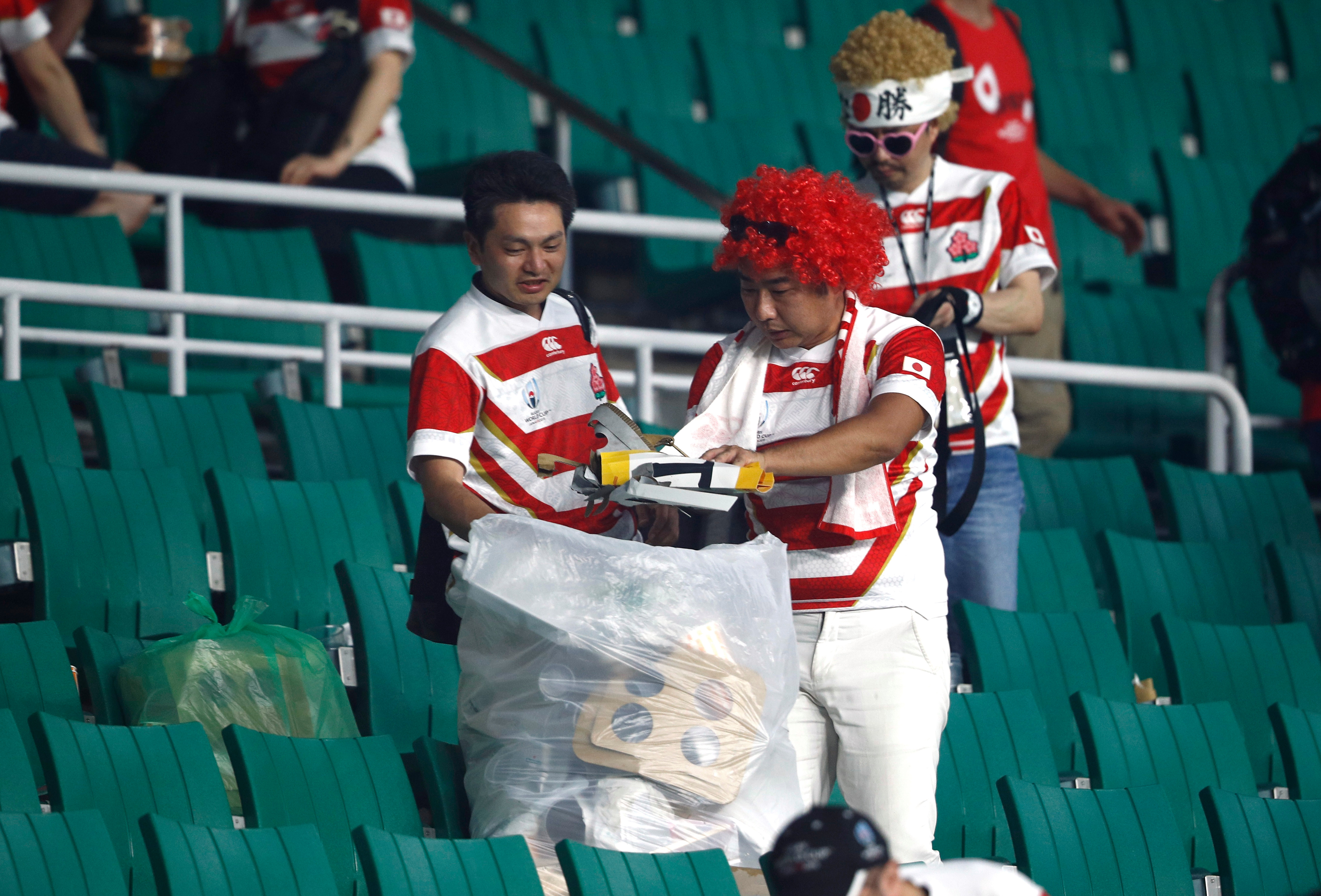  Japan fans even stayed to clean up after watching their famous win