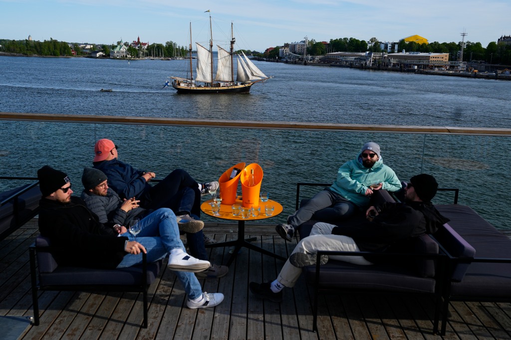 A sailing boat moves in a harbor of Helsinki, Finland,