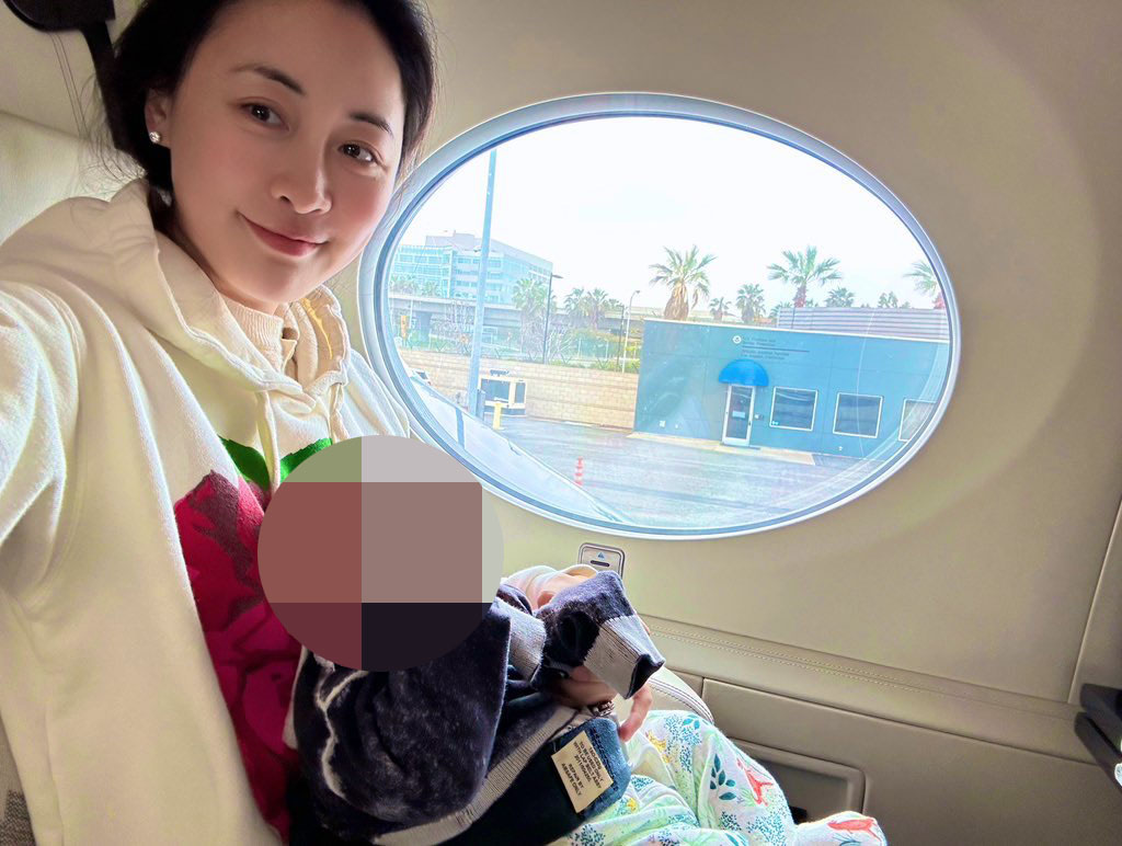 Xiaotian and her son on a private plane in April.