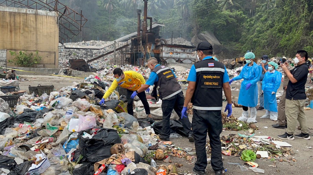 Thai police forensic officers investigate a garbage dump site as they search for parts of the body of a Colombian surgeon in Koh Phagnan island, southern Thailand, Friday, Aug. 4, 2023.