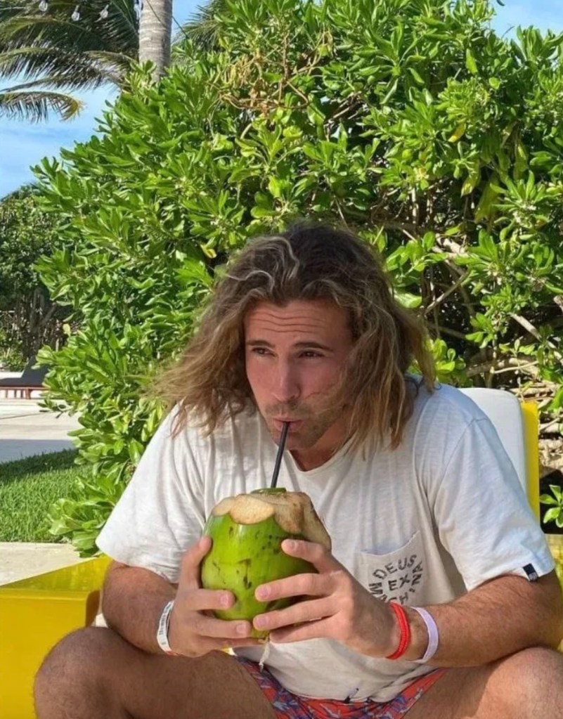 Daniel Sancho Bronchalo drinking from a coconut