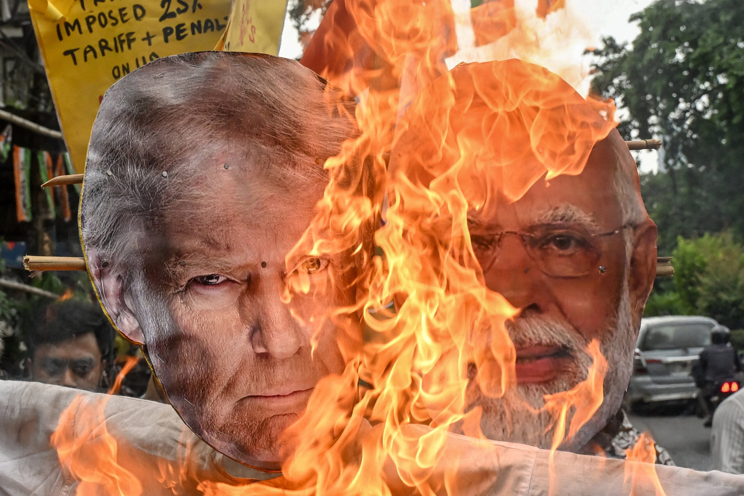 India’s opposition party Congress burn an effigy of US President Donald Trump and Indian Prime Minister Narendra Modi as they protest against the Indo-US trade deal
