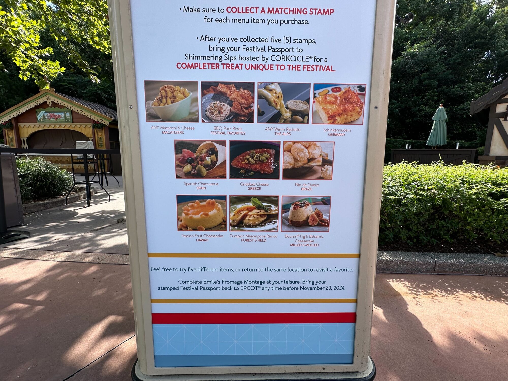 Menus (With Prices) for 2024 EPCOT International Food & Wine Festival 77 Signboard displaying dishes for a food festival, including poutine, garlic cheese bread, and frozen margaritas. Instructions for collecting stamps and redeeming a festival passport are included.