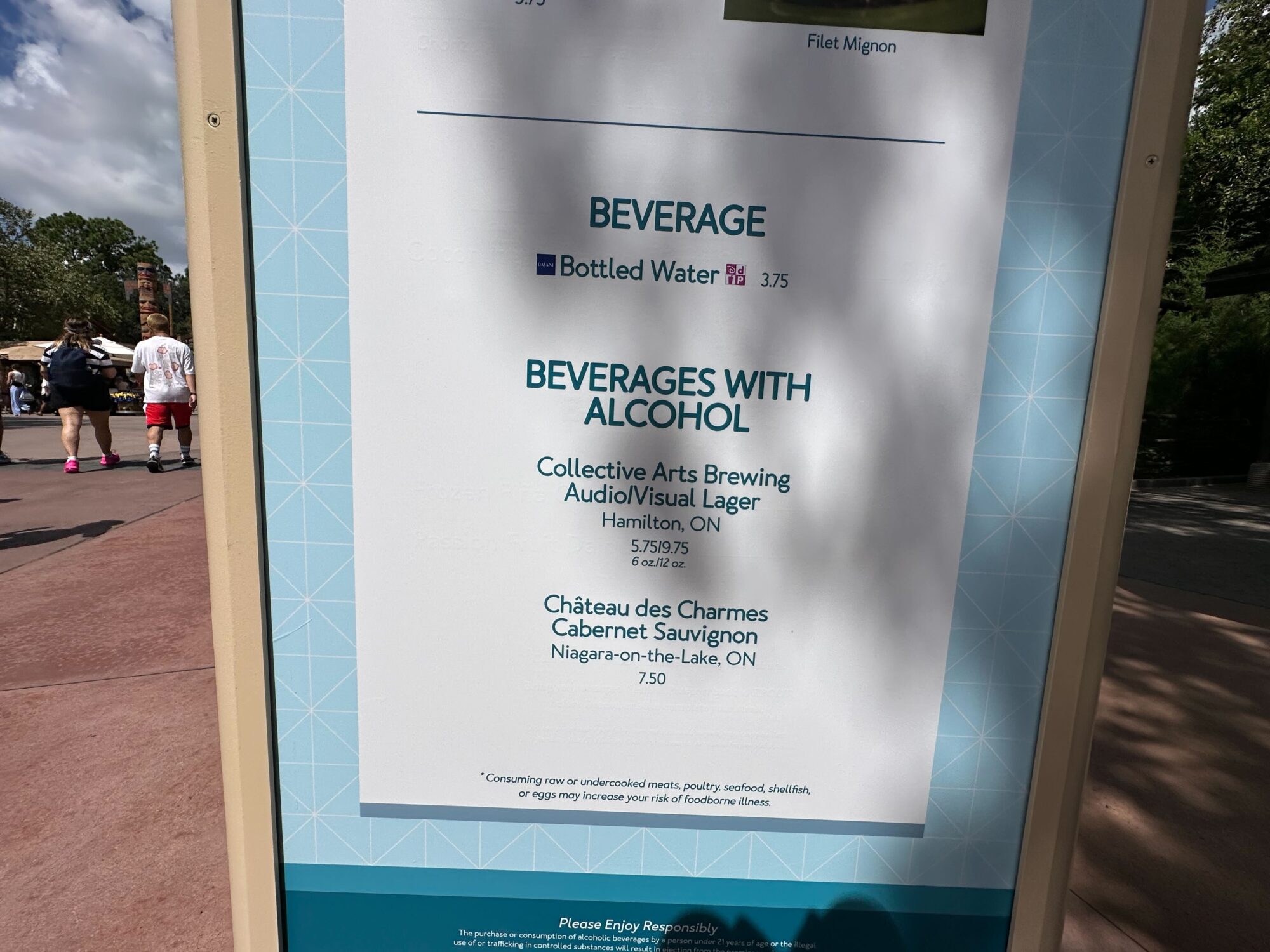 Menus (With Prices) for 2024 EPCOT International Food & Wine Festival 58 Sign featuring beverage options at the food & wine festival, including bottled water and alcoholic beverages such as lager from Collective Arts Brewing and Cabernet Sauvignon from Château des Charmes. Explore our carefully curated menus for a delightful experience.