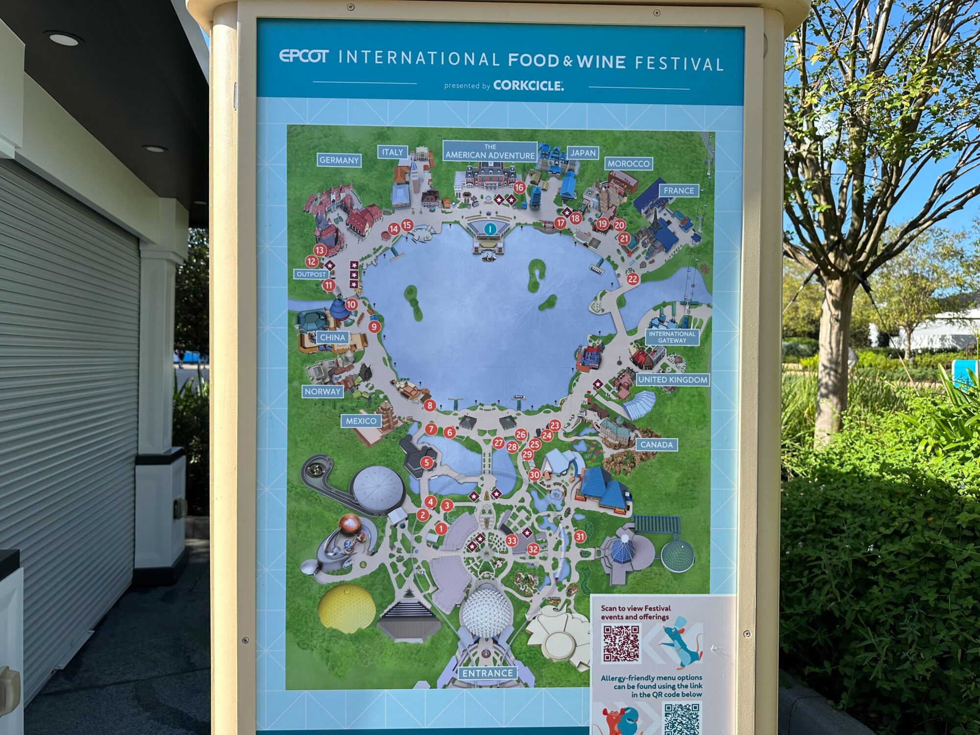 Menus (With Prices) for 2024 EPCOT International Food & Wine Festival 2 Map of Epcot International Food & Wine Festival showing various country pavilions and food booths around a central water feature. A QR code for further details is visible at the bottom right.