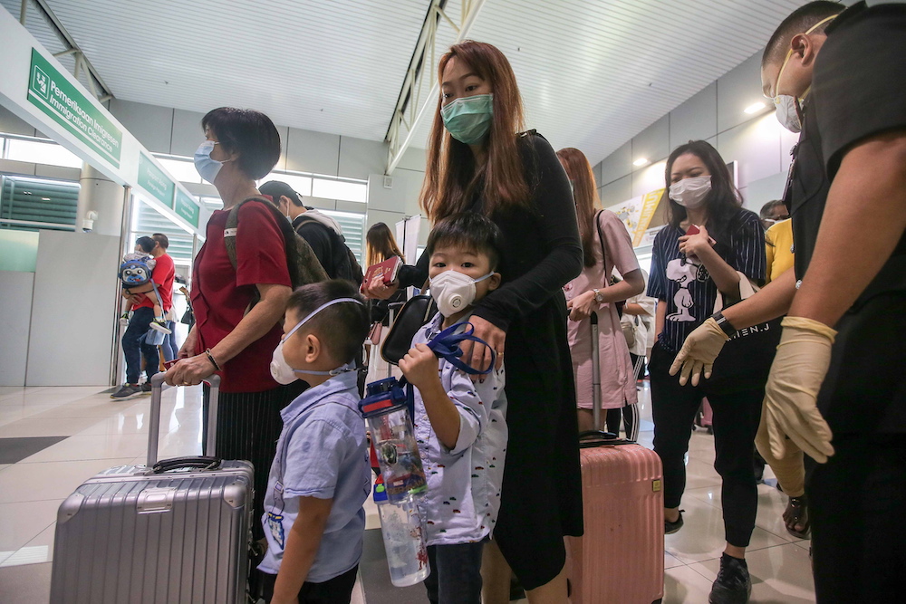 Visitors in face masks land at Sultan Azlan Shah Airport in Ipoh January 30, 2010. — Picture by Farhan Najib Visitors in face masks land at Sultan Azlan Shah Airport in Ipoh January 30, 2010. — Picture by Farhan Najib