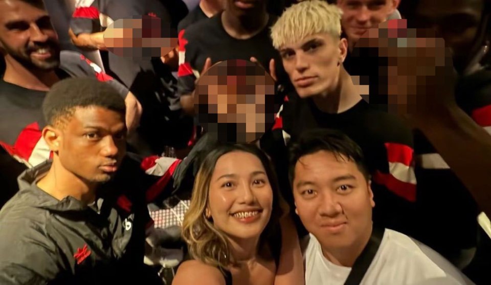 Amad Diallo with other Manchester United players and fans.