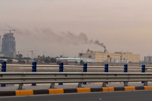 Smoke rising from a building in the distance, in central Baghdad