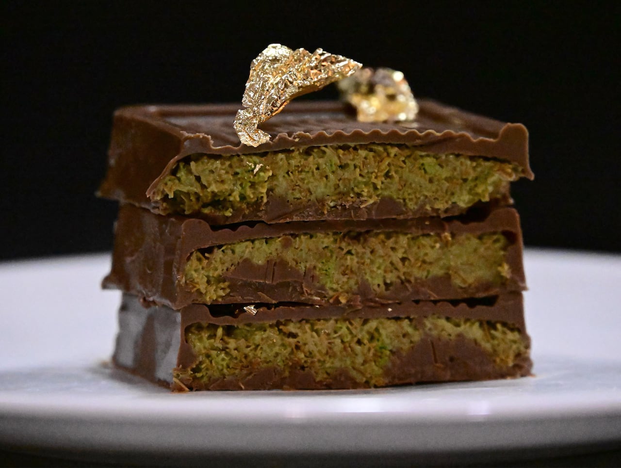 A stack of chocolate bars with green insides are pictures on a plate
