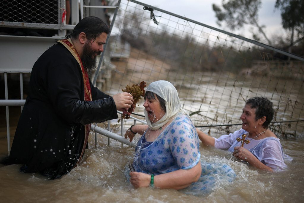 Christian Orthodox worshippers participate in a ceremony, near Jericho