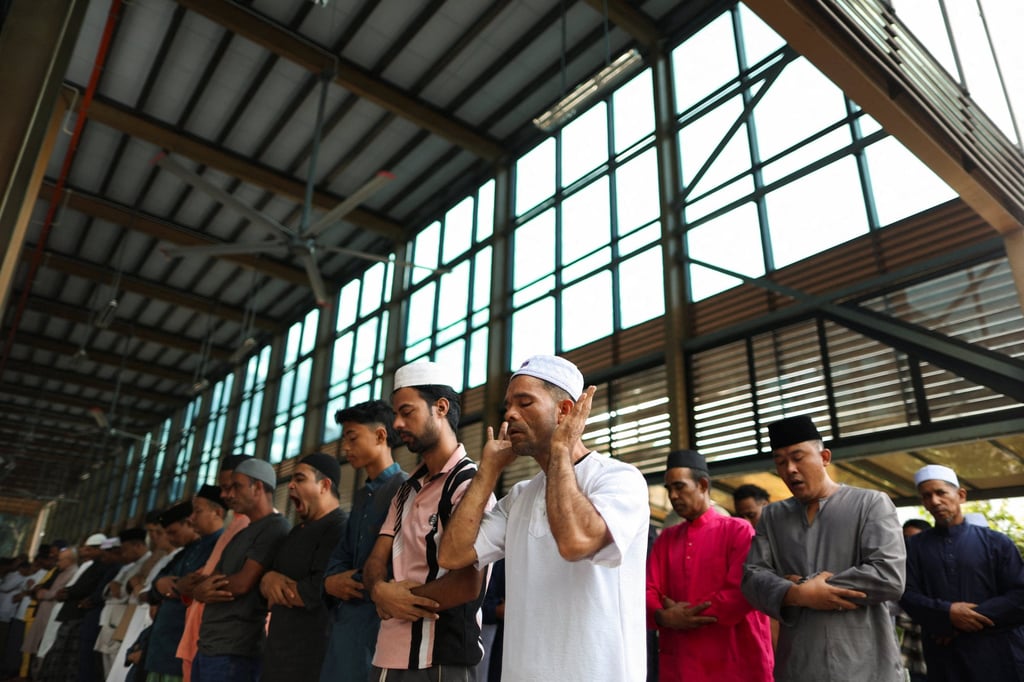 Muslims perform Eid ul-Adha mass prayers at a mosque in Ampang, Malaysia, on Wednesday. Islam is the religion of the Malaysian federation and Muslims make up 20.6 million people. Photo: Reuters Muslims perform Eid ul-Adha mass prayers at a mosque in Ampang, Malaysia, on Wednesday. Islam is the religion of the Malaysian federation and Muslims make up 20.6 million people. Photo: Reuters