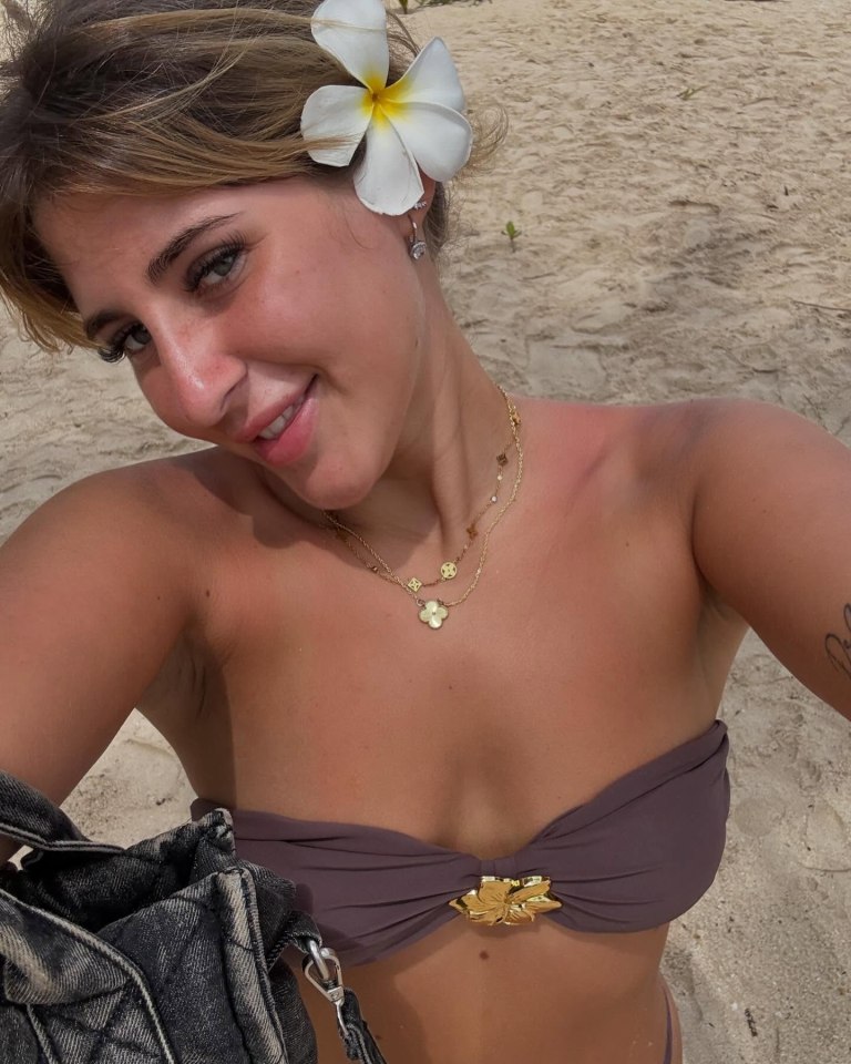 Photo of a young woman on a beach.