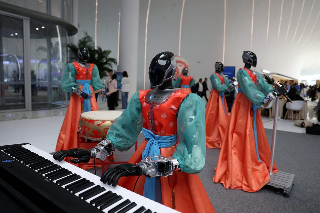 Humanoid robot by Linkerbot dressed up in a costume sits next to a piano as a demonstration, at the 2026 Zhongguancun forum, in Beijing