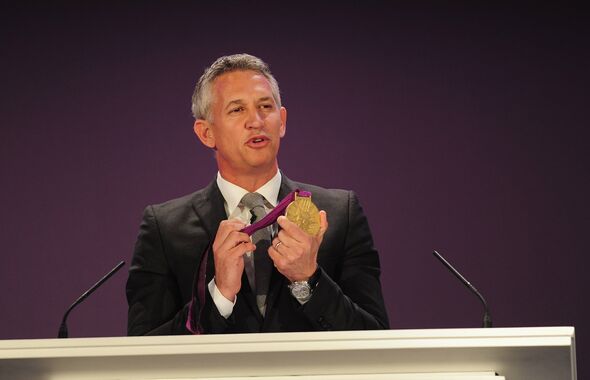 Gary Lineker holding an Olympic medal Gary Lineker holding an Olympic medal