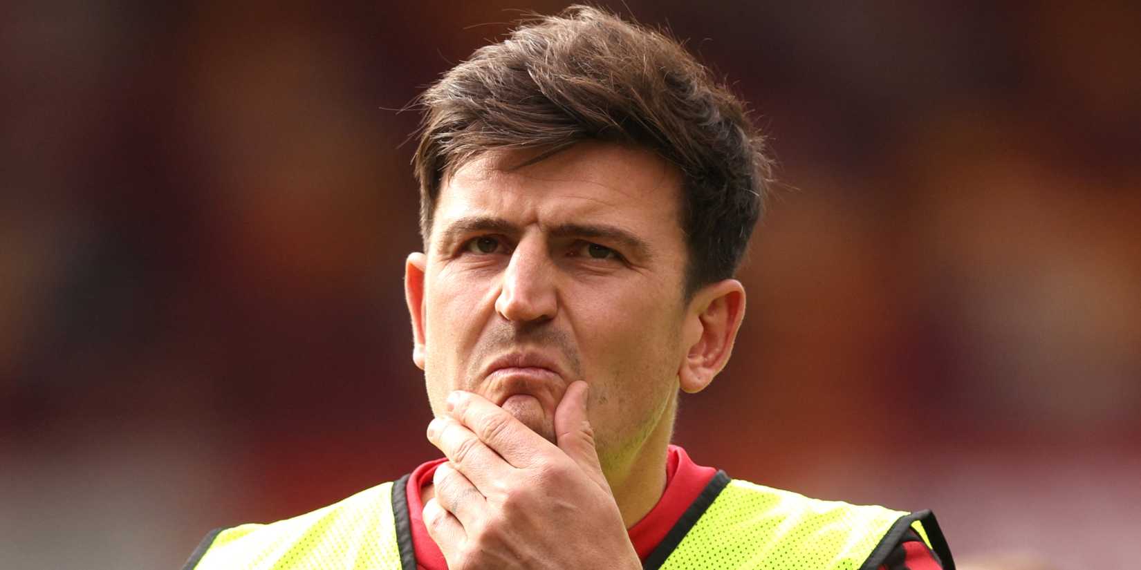 Manchester United's Harry Maguire strokes his chin and thinks during the warm up away against Brentford
