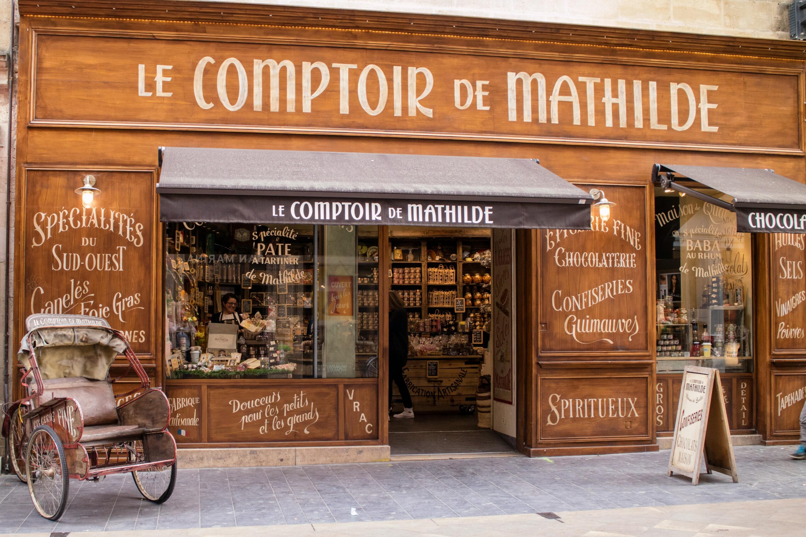 Traditional French storefront of Le Comptoir de Mathilde in Bordeaux, offering local delicacies.