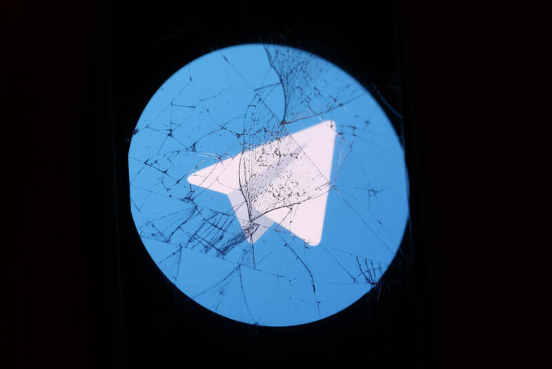 Telegram logo displayed on a phone screen is seen through the broken glass in this illustration photo taken in Krakow, Poland on August 27, 2024.