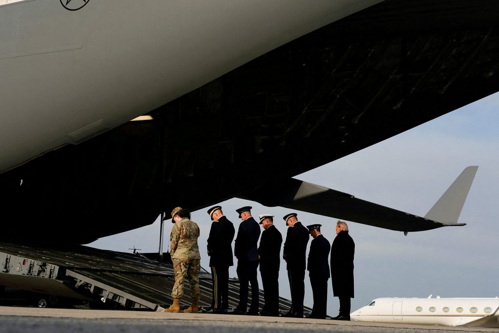 US President Donald Trump participates in a dignified transfer of the remains of two Iowa National Guard members, in Dover