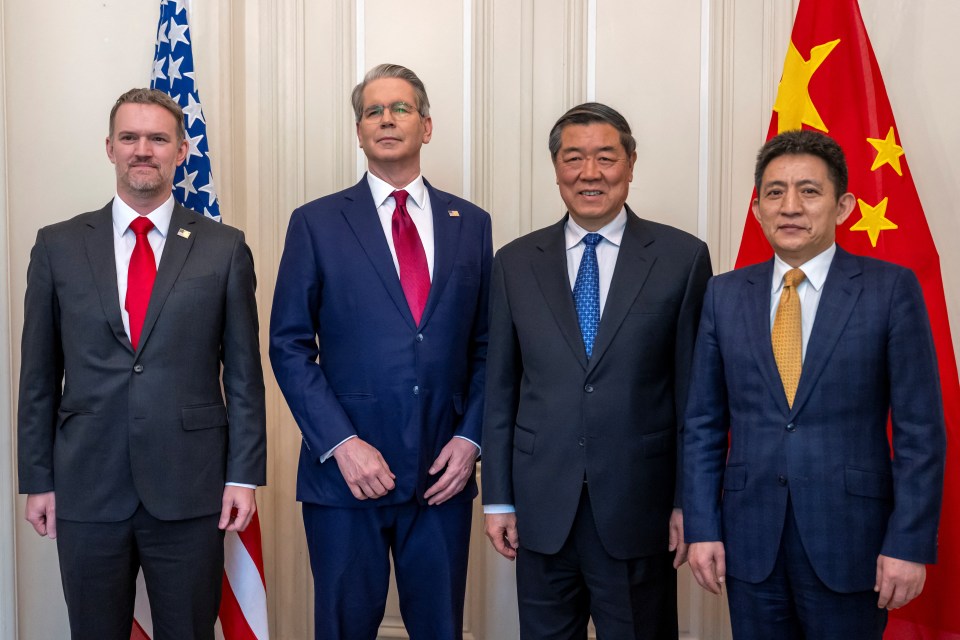 Photo of four men in suits at a bilateral meeting between the U.S. and China.