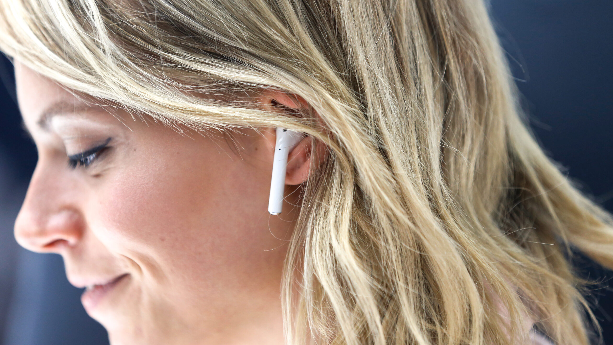 An attendee wears an Apple AirPods during a launch event on September 7, 2016 in San Francisco, California. Apple Inc. unveiled the latest iterations of its smart phone, the iPhone 7 and 7 Plus, the Apple Watch Series 2, as well as AirPods, the tech giant's first wireless headphones. (Photo by Stephen Lam/Getty Images)