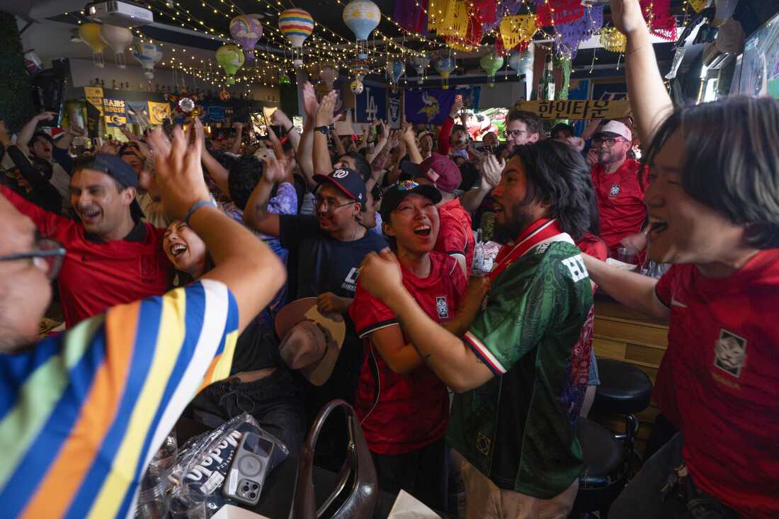 Josh Lee and Fernando Delgado spend time at the Biergarten in Koreatown alongside members of the Los Angeles Football Club's Tigers Supporters Group while watching a soccer match between South Korea and the Czech Republic on June 11, 2026.