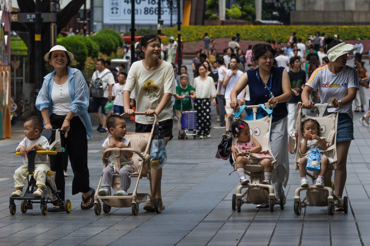 Women Push Toddlers in Strollers in Chongqing