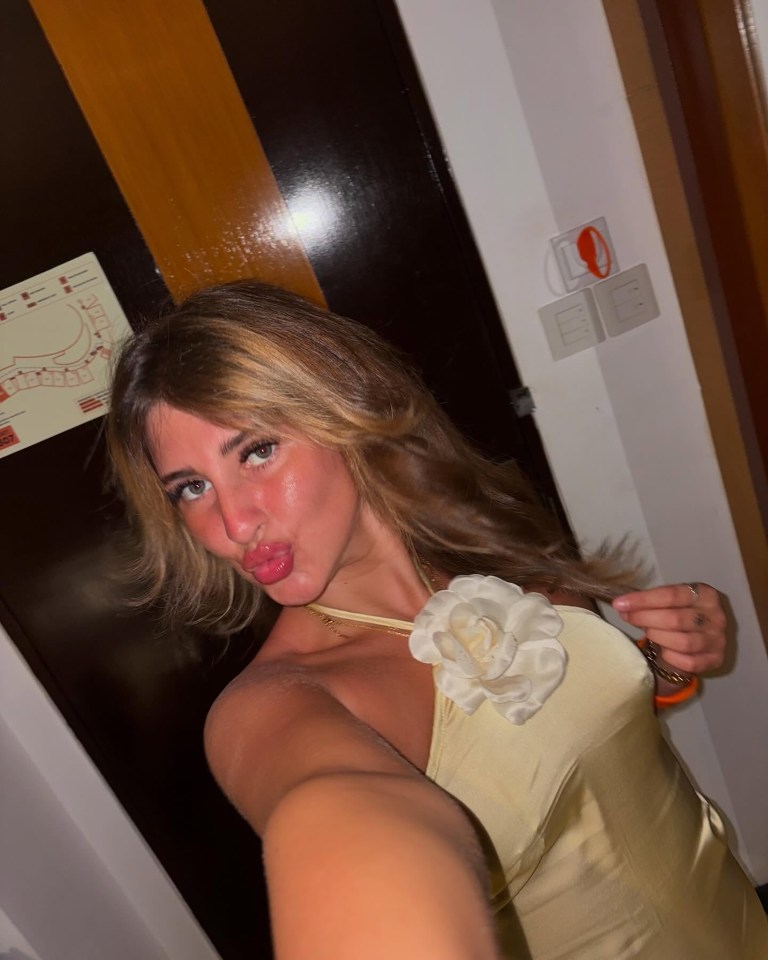 Selfie of a woman in a pale yellow dress.